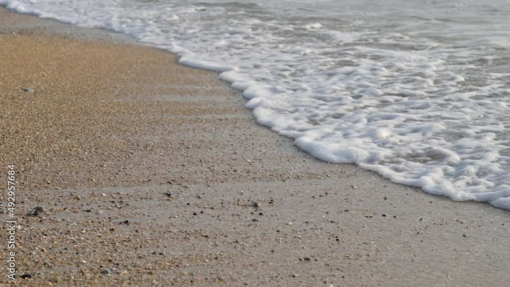Landscapes view of beach sea sand in summer day. Mediterranean Sea rolling in sunshine to the sandy beach Landscapes view of beach sea sand in summer day. Mediterranean Sea rolling in sunshine to the sandy beach