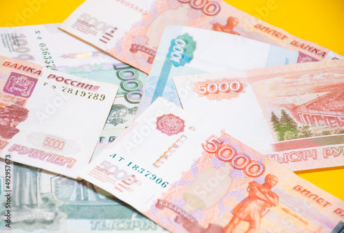 Ivanovo, Russia - 03.03.2022:Selective focus on "bank Russia" scattered money of Russian banknotes: devaluation ruble, crisis or winning lottery, an increase in pensions or payments, financial fraud