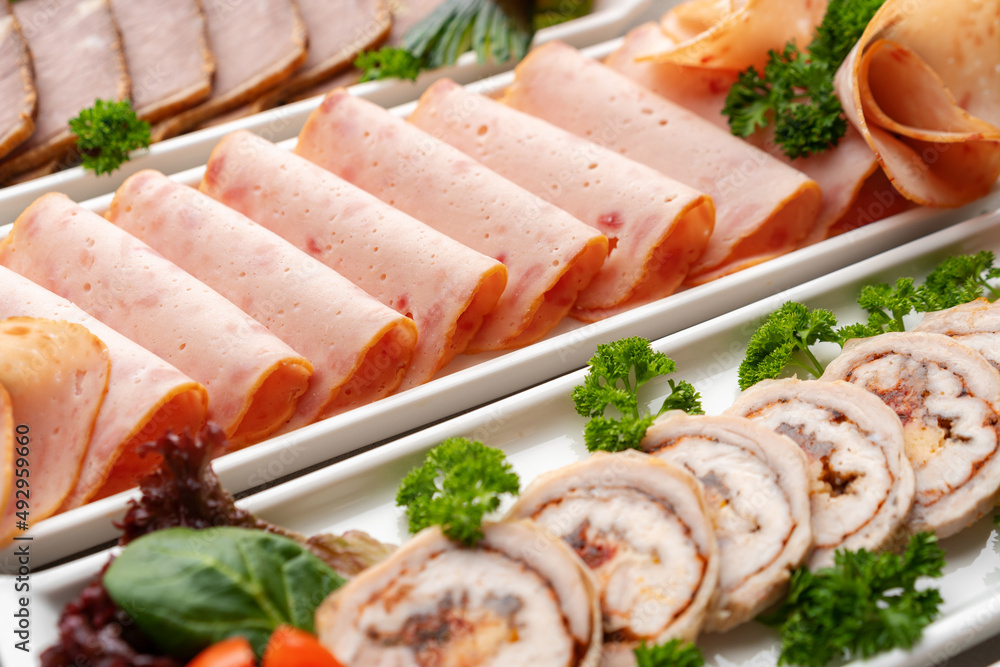 Platter of fresh meat cold cuts on table Platter of fresh meat cold cuts on table