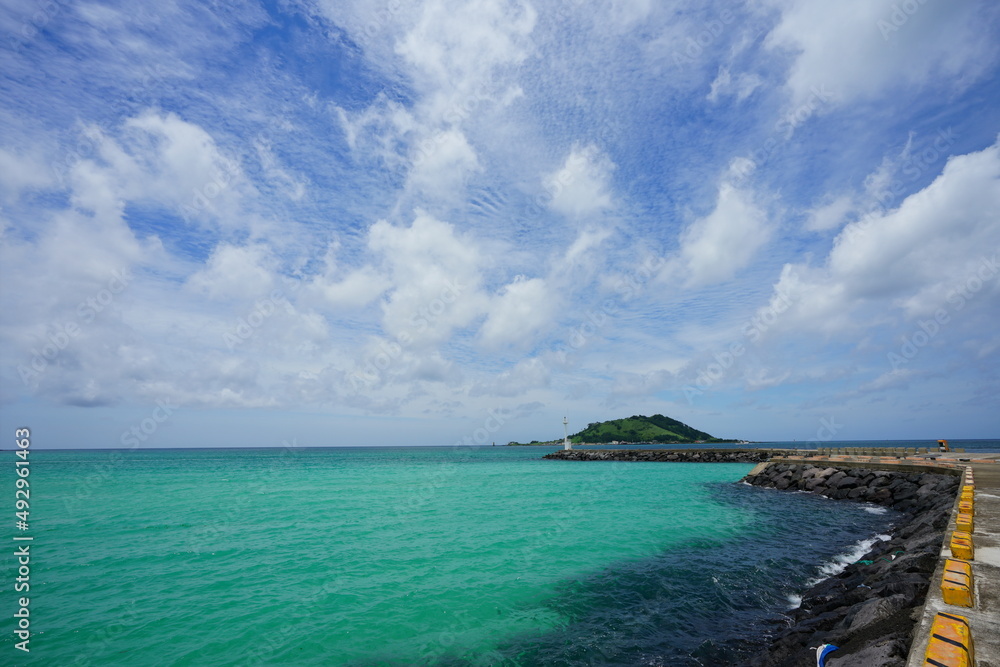 beautiful seascape with island and clouds beautiful seascape with island and clouds