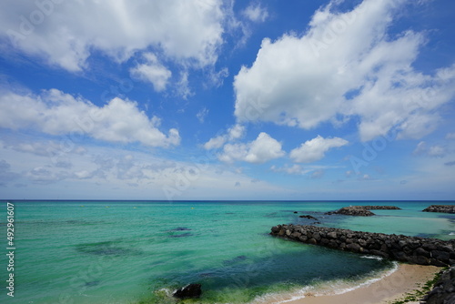 emerald green sea and charming clouds