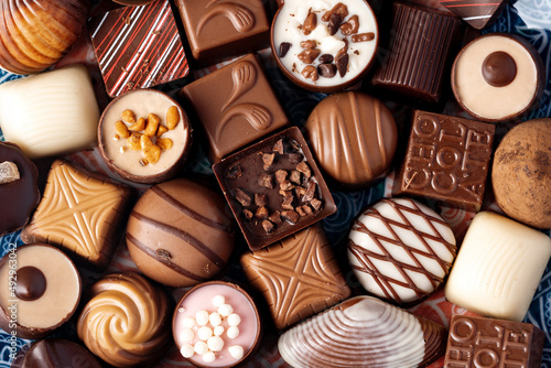 Various chocolate praline candies assortment close up