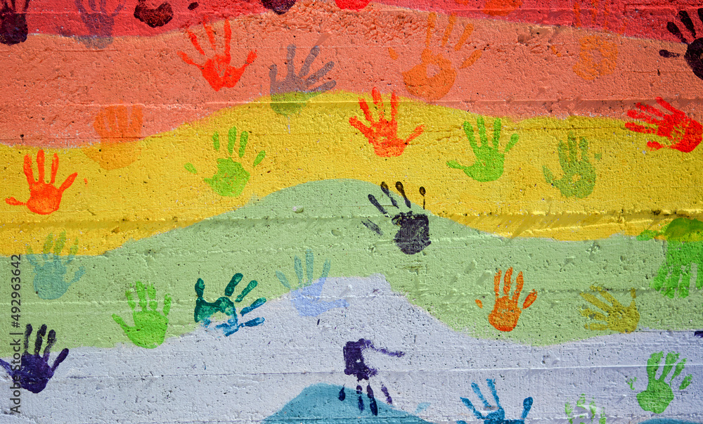 a rainbow with the hands of children's hope
