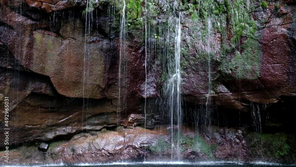 Water Spring Running Through Rocks Water spring running down the cliffs, rocks. Travel the world. Amazing ...