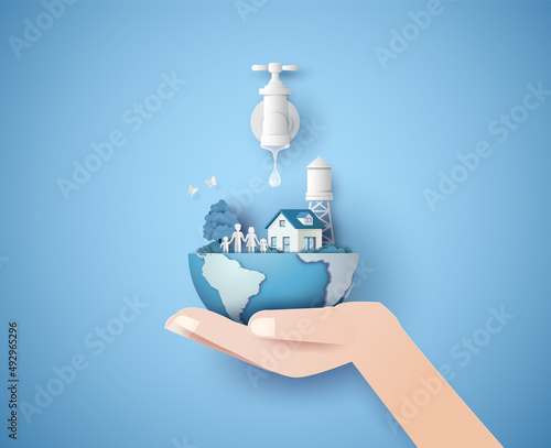 Hand Holding Eco World with Faucet and House