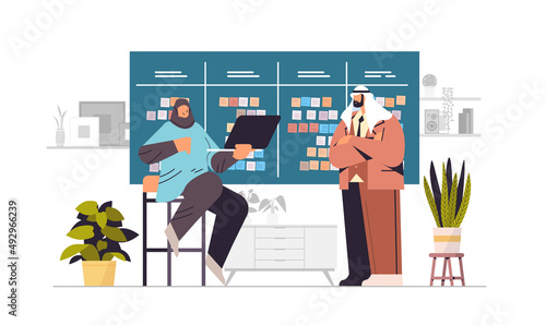 arab businesspeople planning day scheduling appointment in agenda meeting plan time management concept