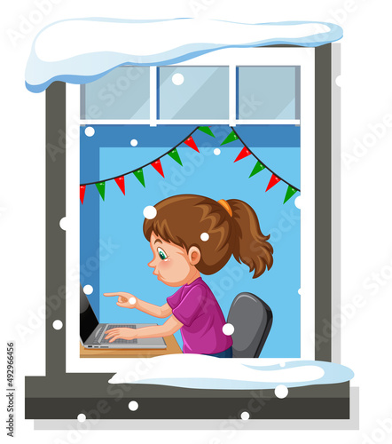 View through the window of a girl doing homework