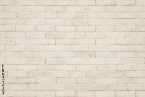 Old brick wall abstract background. Design geometric beige texture room decoration. © Phokin
