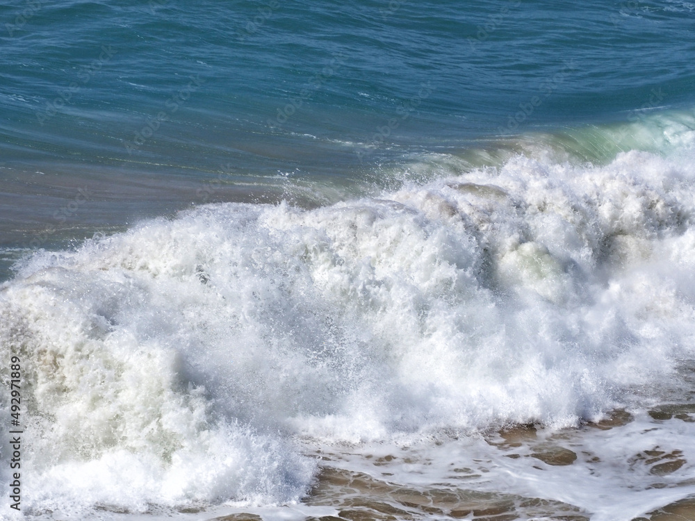 Beautiful foamy sea waves in bad weather.A storm at sea.