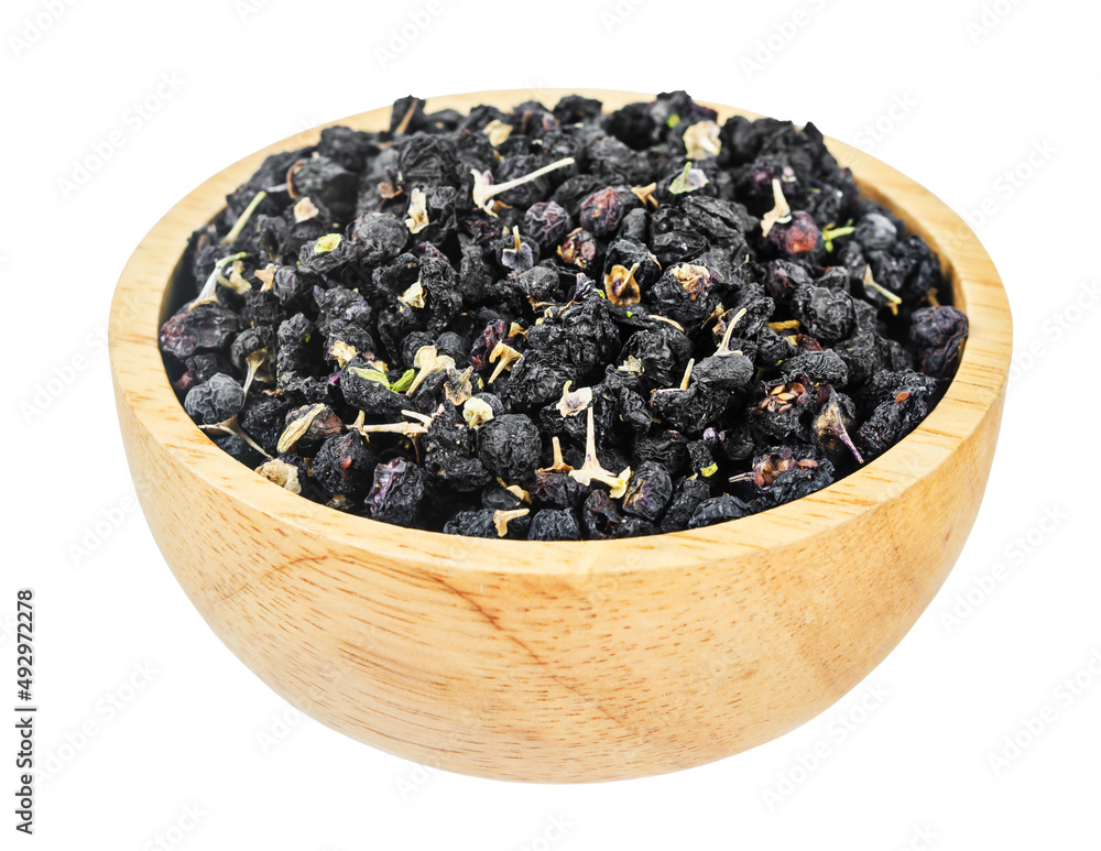 Dried Black wolfberries or black goji berries in wooden bowl isolated on white background. Dried Black wolfberries or black goji berries in wooden bowl isolated on white background.