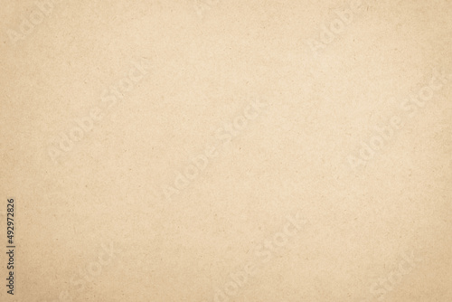 Brown recycled craft paper texture background. Cream cardboard texture vintage.