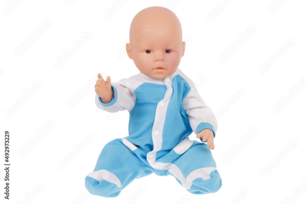baby doll in blue overalls sits on the pope isolated on a white background baby doll in blue overalls sits on the pope isolated on a white background