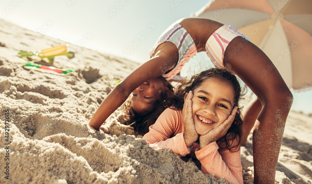 Active little girls having fun together at the beach – Jacob Lund