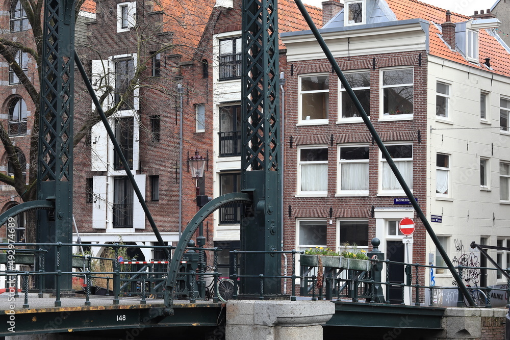 Amsterdam Brouwersgracht Canal Street View with Dommersbrug Bridge Close Up and House Facades, Netherlands