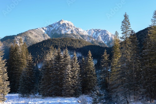 Fototapeta Naklejka Na Ścianę i Meble -  Beautiful winter views of the High Tatra Mountains with tourists, skiers and amazing states of nature