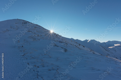 Beautiful winter views of the High Tatra Mountains with tourists  skiers and amazing states of nature