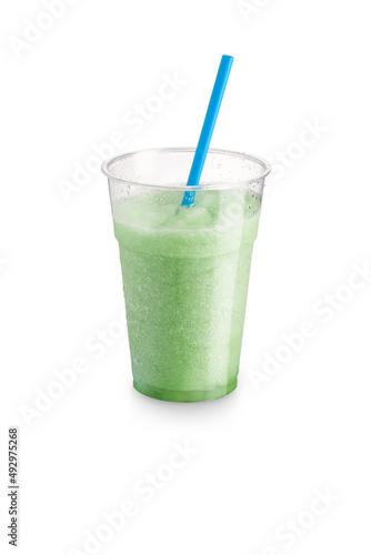 Sicilian mint flavored granita with straw and transparent glass on a white background