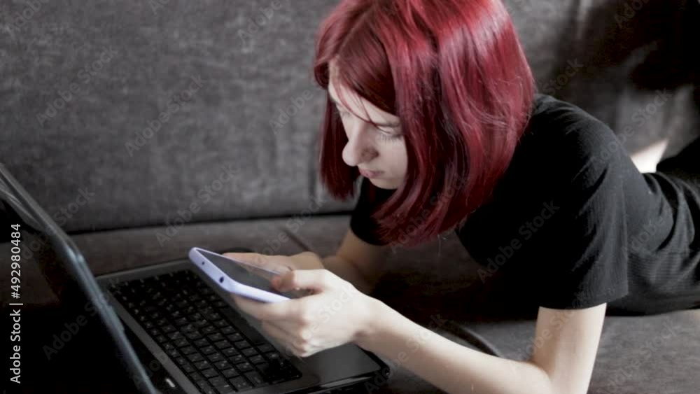 Happy teen girl holding cell phone using smartphone device at home. Young woman blogger subscribing new social media, buying in internet, ordering products online in apps. Happy teen girl holding cell phone using smartphone device at home. Young woman blogger subscribing new social media, buying in internet, ordering products online in apps.
