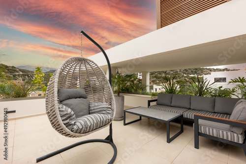 Egg chair swing on a luxury terrace © rilueda