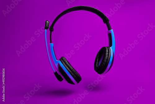 blue headphones violet background