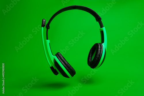 green headset on green background