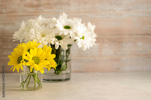 Wallpaper Mural Yellow and white chrysanthemum flower bouquets in vase. Spring composition with daisy flowers. Torontodigital.ca