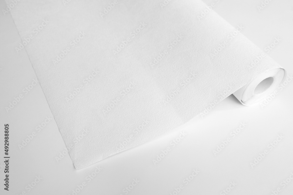 Rolled sheet of white textured wallpaper, on white background ...