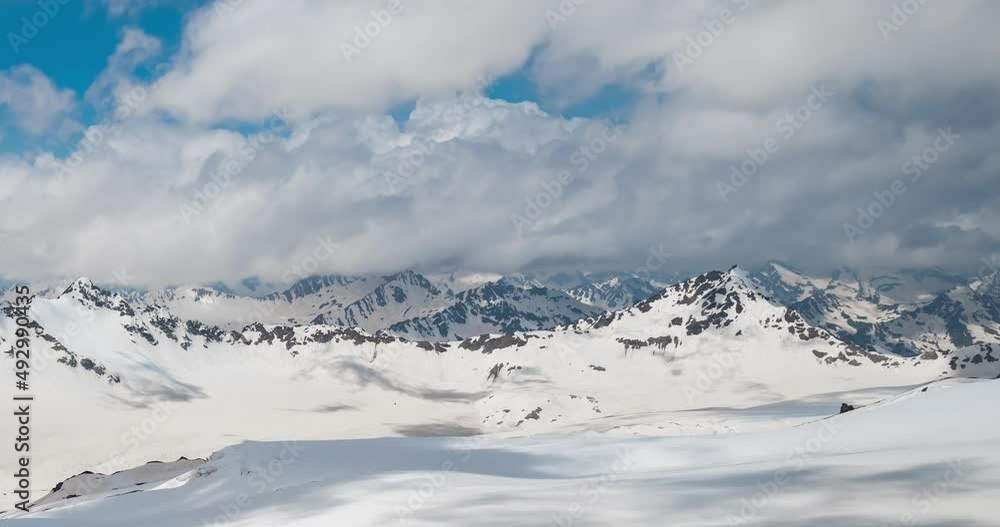 Timelapse Mountain clouds over beautiful snow-capped peaks of mountains and glaciers. Timelapse Mountain clouds over beautiful snow-capped peaks of mountains and glaciers.
