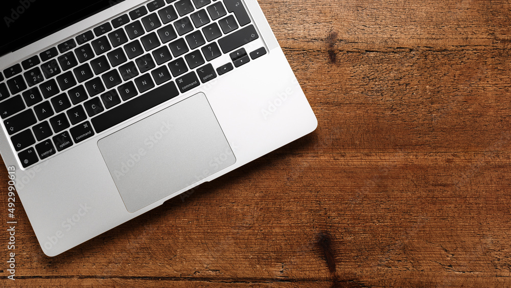 laptop keyboard on wooden rustic table top view laptop keyboard on wooden rustic table top view