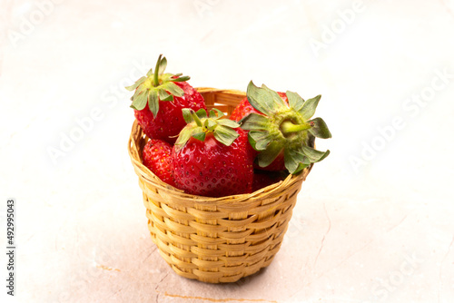 Fresh and Juicy beautiful organic strawberries on wooden background.Top view point.