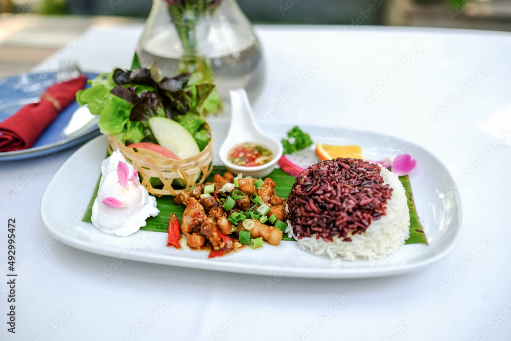 Stir-fried pork belly with garlic and chili, serve with rice and poached egg Stir-fried pork belly with garlic and chili, serve with rice and poached egg