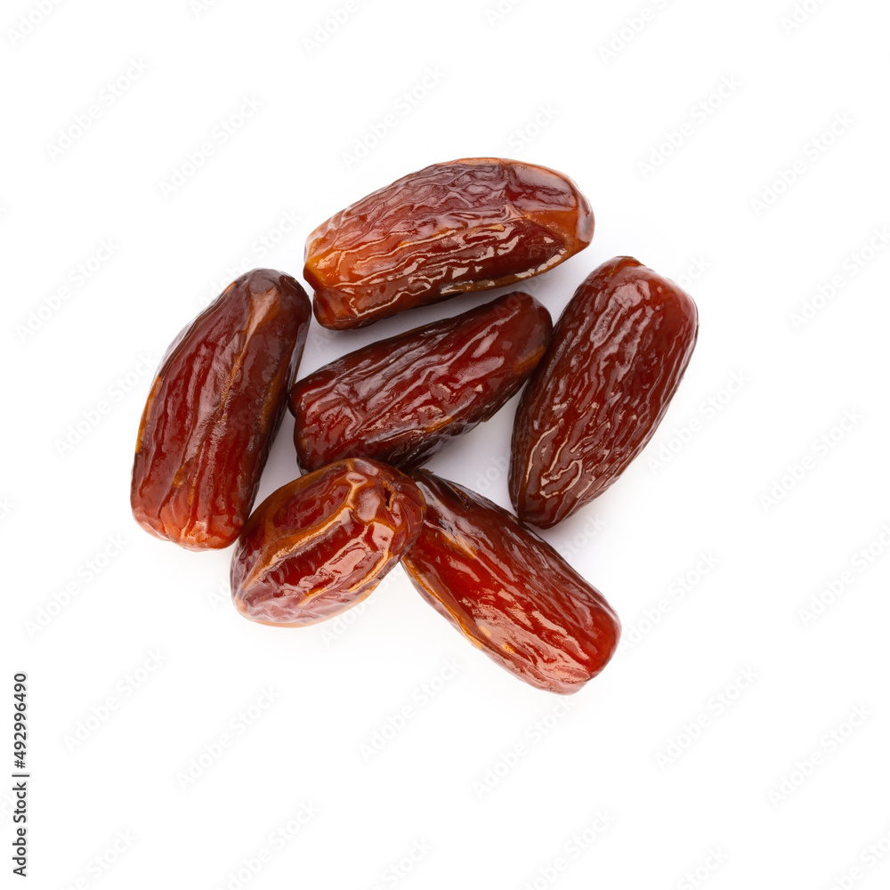 Dry dates isolated on white background. Top view. Flat lay pattern. Dry dates isolated on white background. Top view. Flat lay pattern.