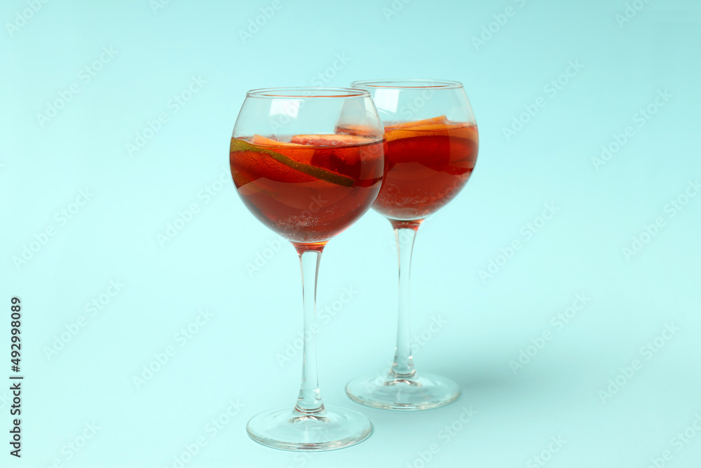 Concept of drink with Sangria on blue background Concept of drink with Sangria on blue background