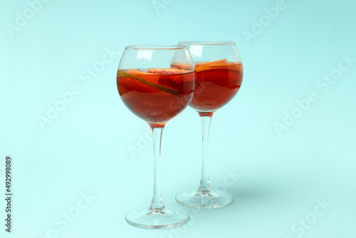Concept of drink with Sangria on blue background
