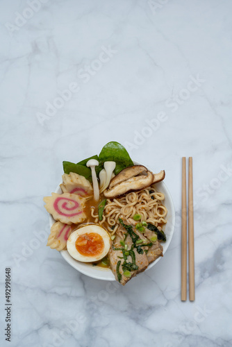 Ramen Soup bowl With chopsticks over marble table