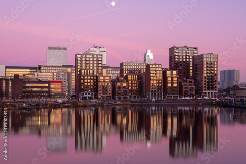 Little C in Rotterdam during a pink sunset and a full moon. 