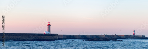 Farolim de Felgueiras is 19th century hexagonal lighthouse on the Douro River, Porto, Portugal during sunrise