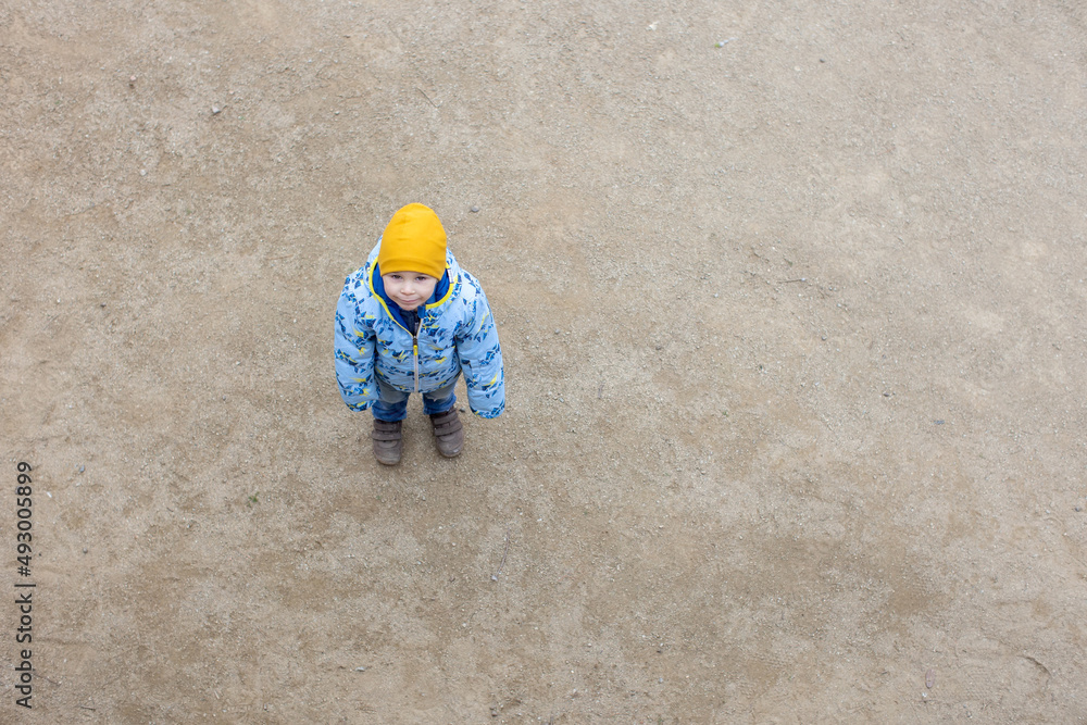 Naklejka premium Child, cute toddler blond boy, posing in park Guell in Barcelona