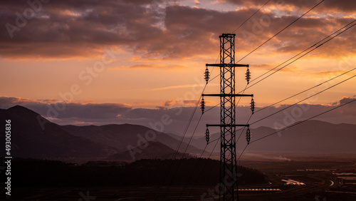 High-voltage power lines. Electricity distribution station. high voltage electric transmission tower. Distribution electric substation with power lines and transformers.