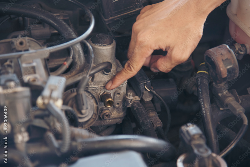 Close up Man hands fixing Car machinery vehicle mechanical service. Mechanic man hands repairing car auto repair shop. open vehicle hood checking up auto mobile. Vehicle Car maintenance engineer.