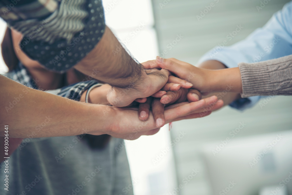 Group of diversity people fist bump holding hands together power of tag team. Teamwork Multiethnic people group working togetherness. Business people team holding hands successful. Business meeting Group of diversity people fist bump holding hands together power of tag team. Teamwork Multiethnic people group working togetherness. Business people team holding hands successful. Business meeting