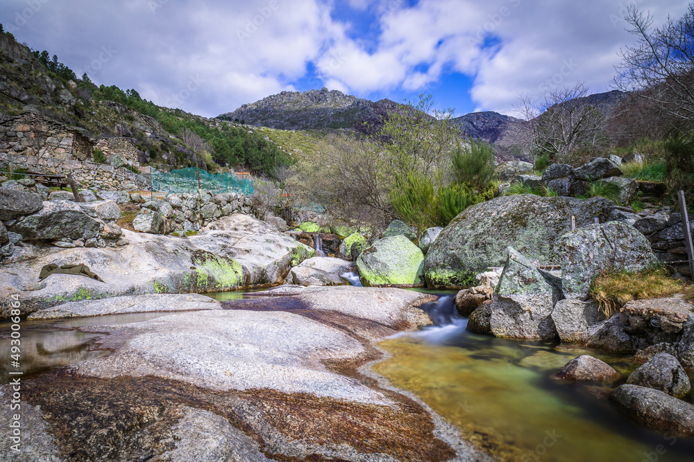 Natural swimming pools with rocks in the touristic place of Loriga, Serra da Estrela - Portugal. River pools at Loriga, Serra da Estrela - Portugal