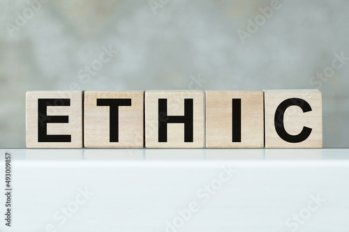ETHIC word on wooden cubes. Social and business concept.