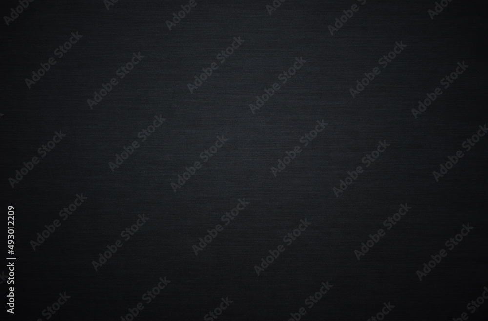 Black textured cardboard surface as background