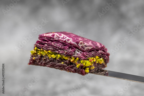 Pistachio Purple baklava (violet baklava). Traditional Middle Eastern Flavors. Local name Mor Baklava. close up. photo