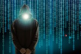 Computer hacker. Obscured dark face. Data thief, internet fraud, darknet and cyber security concept.