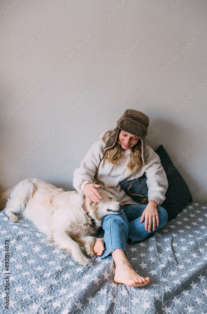 Portrait of a woman and her life-style labrador retriever at home Portrait of a woman and her life-style labrador retriever at home