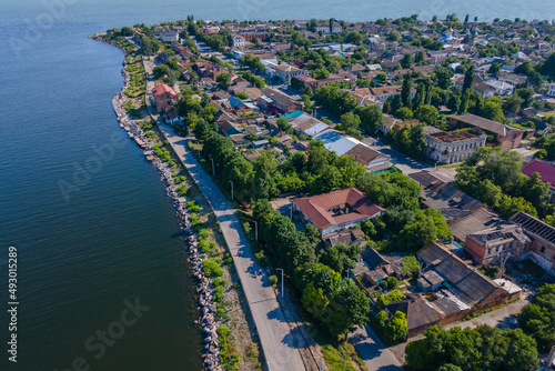 Kakhovskoye reservoir in the city of Nikopol. Ukraine. View from drone. Summer warm day. Place for a walk for adults and children near the water photo