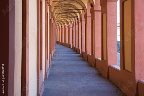 Beautiful streets of Bologna in the morning, arcaded streets with columns photo