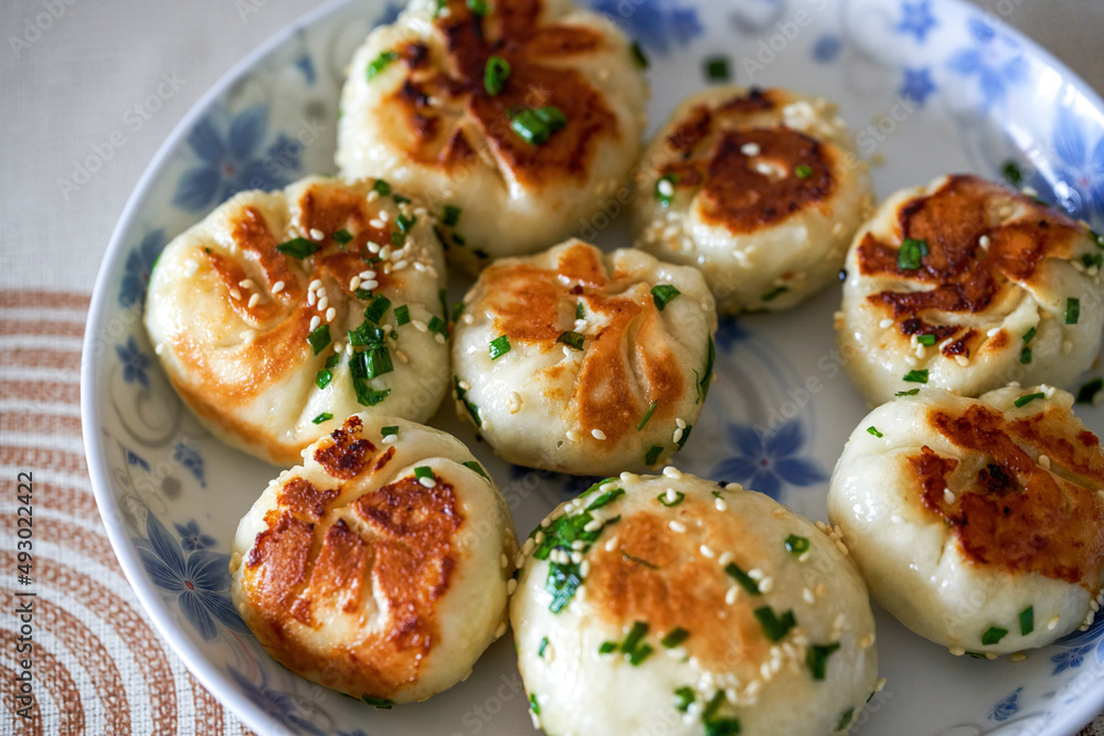 A plate of golden and tempting fresh pork fried buns